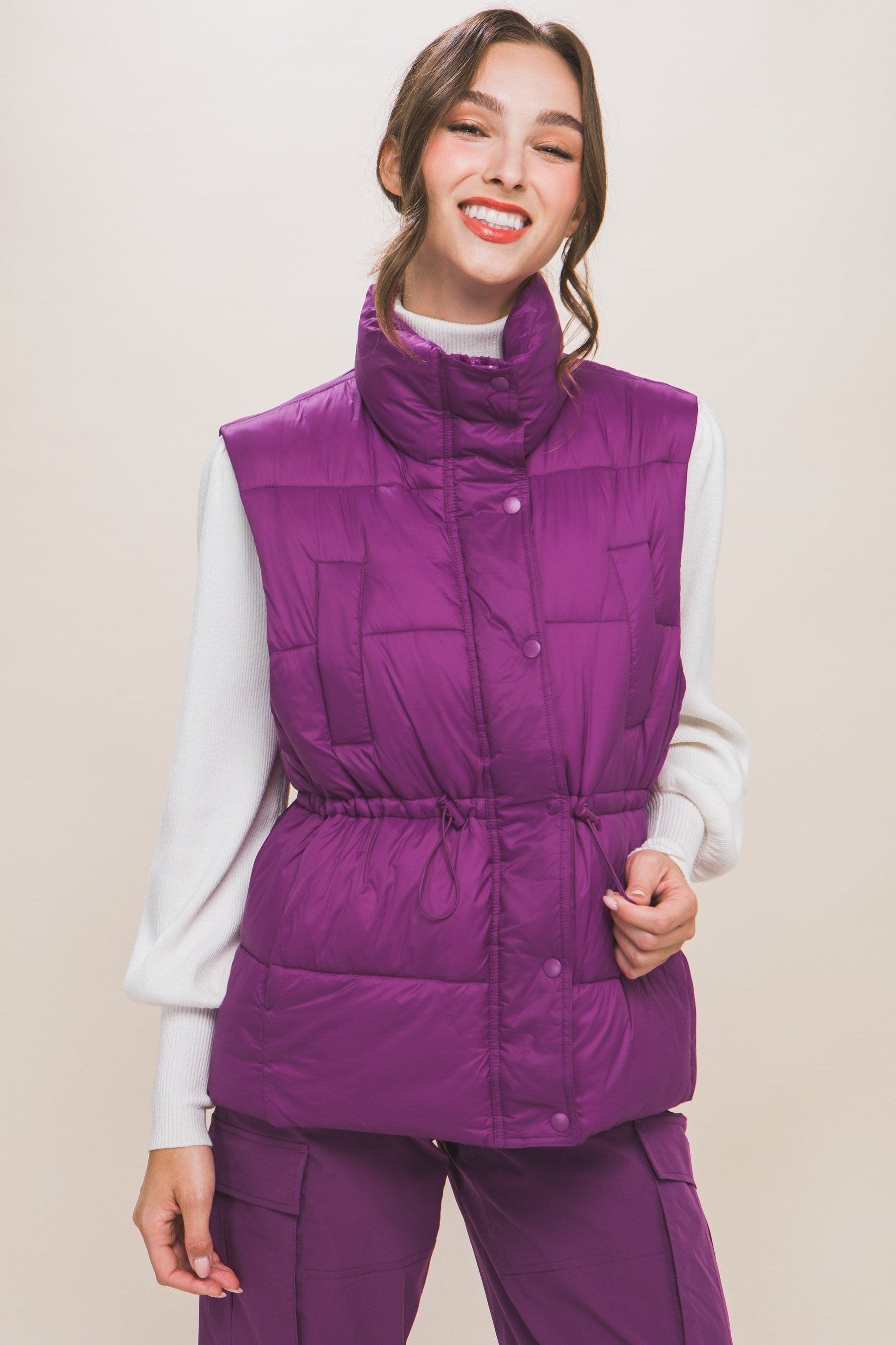 Women's Color Zip up button puffer vest with waist toggles